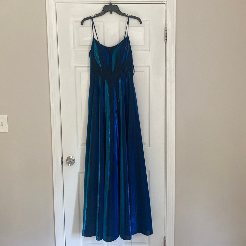 Beautiful brand new metallic dress for any special occasion with a slit.